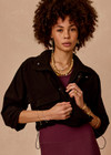THE UPSIDE women's black Ace Shell Jacket is a water-resistant cropped zip-through jacket and features front pockets and an adjustable drawcord at waist. Made for running.