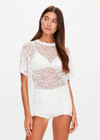 THE UPSIDE women's white Memento Lace Sammi Tee is designed to be sheer, oversized and can be paired with the Capri Bra for coverage. Made for lifestyle.