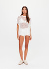 THE UPSIDE women's white Memento Lace Sammi Tee is designed to be sheer, oversized and can be paired with the Capri Bra for coverage. Made for lifestyle.