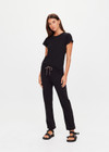 THE UPSIDE women's black organic cotton Kayne Track Pant is a classic mid-rise track pant and features a soft elasticated waistband with a brown paracord drawcord, elasticated cuffs and finished with a subtle embroidered arrow logo at back. The perfect everyday track pant, made to last.