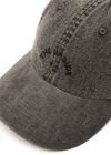 THE UPSIDE women's black Cosmic Washed Denim Soft Cap features a horseshoe logo at front and an adjustable strap at back.