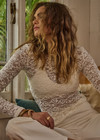 THE UPSIDE women's cream Lyon Rosa Long Sleeve Top is a fitted, sheer lace style with a crew neckline. Made for everyday wear and layering.