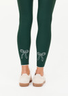 THE UPSIDE women's green recycled soft peached Racquet 25inch Pocket Legging is mid-rise and features side pockets, an elasticated drawcord and mini scallop lce detailing at cuffs. Made for tennis, golf & pickleball.