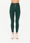 THE UPSIDE women's green recycled soft peached Racquet 25inch Pocket Legging is mid-rise and features side pockets, an elasticated drawcord and mini scallop lce detailing at cuffs. Made for tennis, golf & pickleball.
