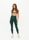 THE UPSIDE women's green recycled soft peached Racquet 25inch Pocket Legging is mid-rise and features side pockets, an elasticated drawcord and mini scallop lce detailing at cuffs. Made for tennis, golf & pickleball.