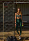 THE UPSIDE women's green recycled soft peached Racquet 25inch Pocket Legging is mid-rise and features side pockets, an elasticated drawcord and mini scallop lce detailing at cuffs. Made for tennis, golf & pickleball.