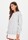 THE UPSIDE women's grey organic cotton Racquet Coolum Crew is an oversized fit with small split at side hem and discreet side pockets. Made for tennis, golf & pickleball.