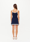 THE UPSIDE women's navy organic cotton blend Lori Knit Mini Dress features a scoop neckline with cream and lilac panels down sides and at hem. Made for tennis, golf & pickleball.