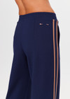 THE UPSIDE women's navy Toledo Petra Flare Pant features tan knitted tape down sides, an elasticated waistband, side pockets and splits at hem. Made for everyday wear.