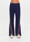 THE UPSIDE women's navy Toledo Petra Flare Pant features tan knitted tape down sides, an elasticated waistband, side pockets and splits at hem. Made for everyday wear.