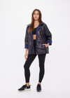 THE UPSIDE women's navy Levi Reversible Quilted Jacket is designed for a relaxed fit and features welt pockets, magnectic snap closure and a water resistant coating on black quilting. The perfect outerwear piece.