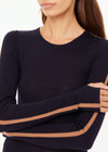 THE UPSIDE women's black Merino Wool Long Sleeve Top is designed for a slim fit and features a crew neck with mocha stripe down sleeve. Made for lifestyle.
