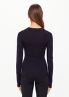 THE UPSIDE women's black Merino Wool Long Sleeve Top is designed for a slim fit and features a crew neck with mocha stripe down sleeve. Made for lifestyle.