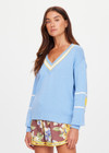 THE UPSIDE women's blue organic cotton Rever Josette V Neck Sweater is designed for a relaxed fit and features a striped V neckline in yellow and blue and contrast starts on sleeves. Made for everyday.