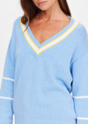 THE UPSIDE women's blue organic cotton Rever Josette V Neck Sweater is designed for a relaxed fit and features a striped V neckline in yellow and blue and contrast starts on sleeves. Made for everyday.