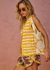 THE UPSIDE women's yellow organic cotton Goldie Watson Crochet Vest is designed for a regular fit and features a hand crocheted flower design and pearl shell buttons. Made for lifestyle.