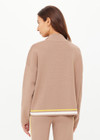 THE UPSIDE women's mocha Veneto Carter Knit Zip Top fits true-to-size and features a half zip and arrow logo on sleeve hem. Made for lifestyle.