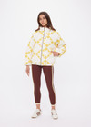 THE UPSIDE women's yellow organic cotton Etoile Carmen Quilted Jacket fits oversized and features front pockets, an elasticated hem and zip through opening. Made for lifestyle.