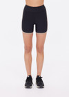 THE UPSIDE women's black recycled rib Rhythm 5inch Spin Short is mid-rise and features cream and mocha binds along side seams. Made for yoga & pilates.