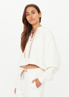THE UPSIDE women's cream organic cotton terry Arkana Priah Hoodie is designed for a relaxed fit with dropped shoulders and features a lace up front. Made for lifestyle.