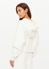 THE UPSIDE women's cream organic cotton terry Arkana Priah Hoodie is designed for a relaxed fit with dropped shoulders and features a lace up front. Made for lifestyle.