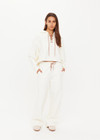 THE UPSIDE women's cream organic cotton terry Arkana Priah Hoodie is designed for a relaxed fit with dropped shoulders and features a lace up front. Made for lifestyle.