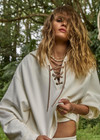 THE UPSIDE women's cream organic cotton terry Arkana Priah Hoodie is designed for a relaxed fit with dropped shoulders and features a lace up front. Made for lifestyle.