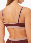 THE UPSIDE women's brown Montage Rory Scoop Knit Sports Bra features a scooped neckline with mid coverage and yellow side pannels. Made for yoga & pilates.
