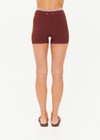 THE UPSIDE women's brown Montage Speechless Short offers a mid-rise fit with a soft waistband and features yellow side pannels, embroidered and rib detail. Made for yoga & pilates.