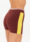 THE UPSIDE women's brown Montage Speechless Short offers a mid-rise fit with a soft waistband and features yellow side pannels, embroidered and rib detail. Made for yoga & pilates.