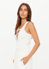 THE UPSIDE women's cream cotton Arkana Rowan Rib Tank has a ribbed fabrication designed for a regular fit and features a lace up front with gold eyelets and braided drawcord. Made for lifestyle.