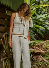 THE UPSIDE women's cream cotton Arkana Rowan Rib Tank has a ribbed fabrication designed for a regular fit and features a lace up front with gold eyelets and braided drawcord. Made for lifestyle.