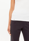 THE UPSIDE women's cream organic cotton Del Rey Pointelle Tank Top features a scooped lace trim neckline with a soft ribbed fabrication. Made for everyday wear.