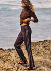 THE UPSIDE women's black Petra Flare Pant features soft, flared fabrication with grey splits at hem, side seam pockets and an elasticated waist. Made for lifestyle.