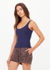 THE UPSIDE women's navy recycled soft peached Amelia Tank Top is designed with a scoop front and back neckline, and features a shelf bra with removable cups. Made for yoga & pilates.