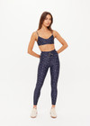 THE UPSIDE women's blue Bellaire Ballet Sports Bra features a cream star print and offers soft support and low coverage, designed with adjustable straps and a supersoft recycled fabrication. Made for yoga & pilates.