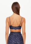 THE UPSIDE women's blue Bellaire Ballet Sports Bra features a cream star print and offers soft support and low coverage, designed with adjustable straps and a supersoft recycled fabrication. Made for yoga & pilates.