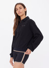 THE UPSIDE women's black organic cotton Collared Elle Polo is a relaxed fit long sleeve with a mocha stripe along ribbed hem and cuffs. Made for everyday wear.