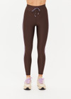 THE UPSIDE women's brown eco tech Oxford 25Inch Legging offers a mid rise with lilac coloured binds down side seams and an elastic drawcord through waist. Made for high impact.