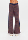 THE UPSIDE women's brown organic cotton Lumiere Juniper Knit Pant is a straight leg pant with a geometric star pattern, a soft elasticated waistband with drawcord and side seam pockets. Made for lifestyle.