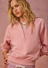 THE UPSIDE women's pink organic cotton french terry McGrath Collared Elle Polo is a relaxed, long sleeve polo with a collar and front buttons. Made for lifestyle.