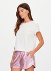 THE UPSIDE women's cream McGrath The 70's Tee is 70's inspired, crafted from a hemp and organic cotton blend and features a contrast rib neckline in pink. Made for everyday wear.