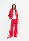 THE UPSIDE women's red 100% silk Two Hearts Silk Bomber Jacket is fully lined with cream and red stripes, welt pockets with triangle detail at top and bottom and an embroidered horse and horseshoe design. Made for lifestyle.