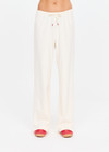 THE UPSIDE women's cream cotton Noosa Calling Track Pant is a low-rise straight leg pant with a soft elastic waistband, made from soft brushed recycled fabric. Made for lifestyle.