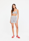 THE UPSIDE women's grey cotton Flash 5Inch Spin Short offers a mid-rise design in stretch jersey fabrication with no front seam. Made for yoga & pilates.