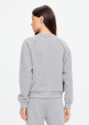 THE UPSIDE women's grey cotton Hit The Road Track Top is a relaxed raglan crew neck sweater in french terry fabrication with a ribbed neckline, arms and cuffs. Made for lifestyle.