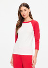 THE UPSIDE women's cream 100% organic cotton Take Me To The Ball Park Top features a soft ribbed neckline with contrast red 3/4 length sleeves. Made for lifestyle.