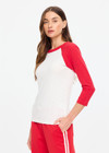 THE UPSIDE women's cream 100% organic cotton Take Me To The Ball Park Top features a soft ribbed neckline with contrast red 3/4 length sleeves. Made for lifestyle.