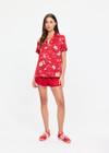 THE UPSIDE women's red  Dusty's Holiday Shirt is a short sleeve button-up in our holiday red and cream printed design and features a patch pocket on front chest. Made for lifestyle.