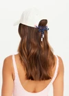 THE UPSIDE women's cream 100% cotton Marlon Soft Cap has an adjustable navy paracord tie at back with gold metal eyelets. Made for lifestyle.